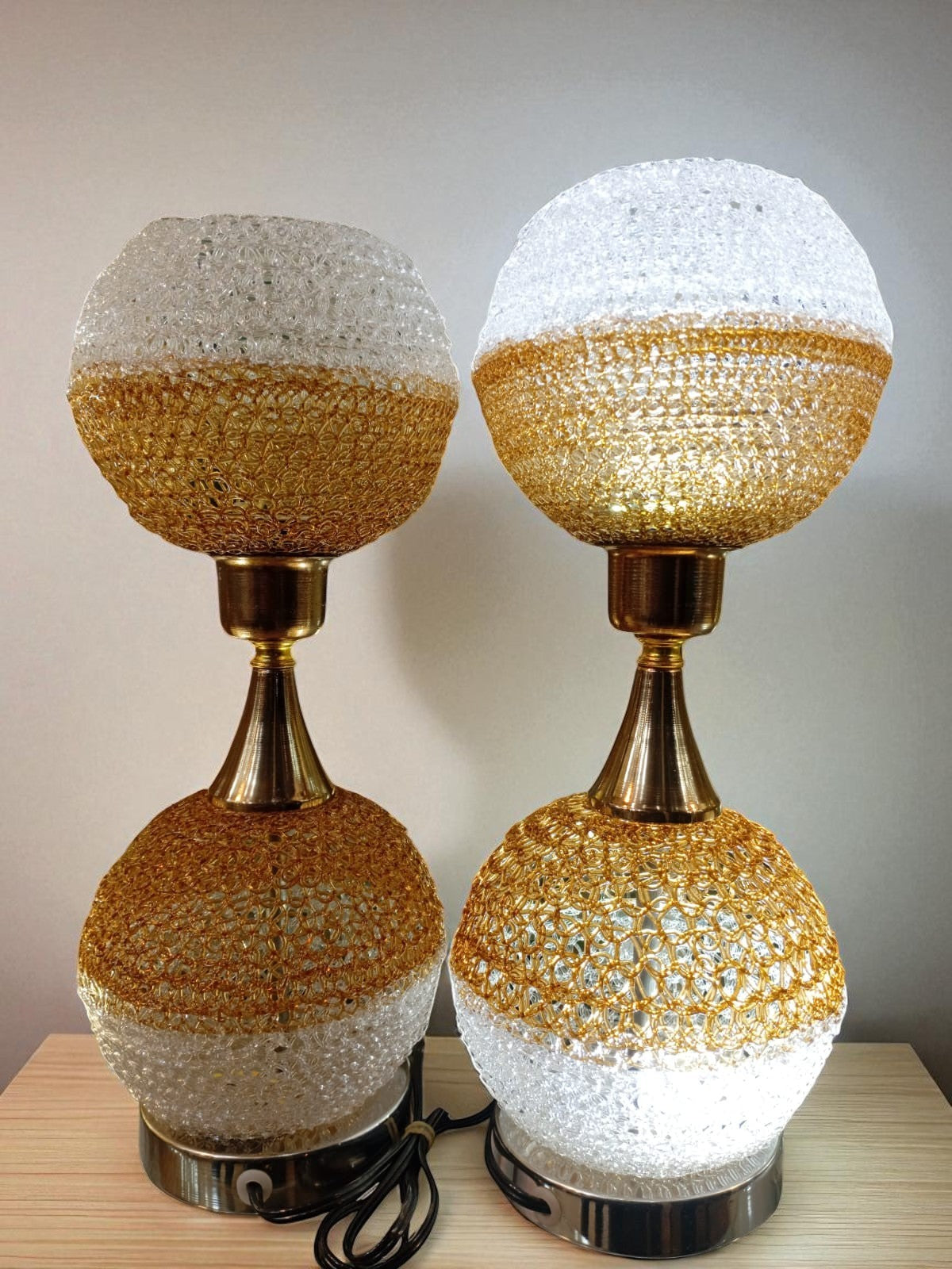 modern table lamps with textured glass and gold accents.